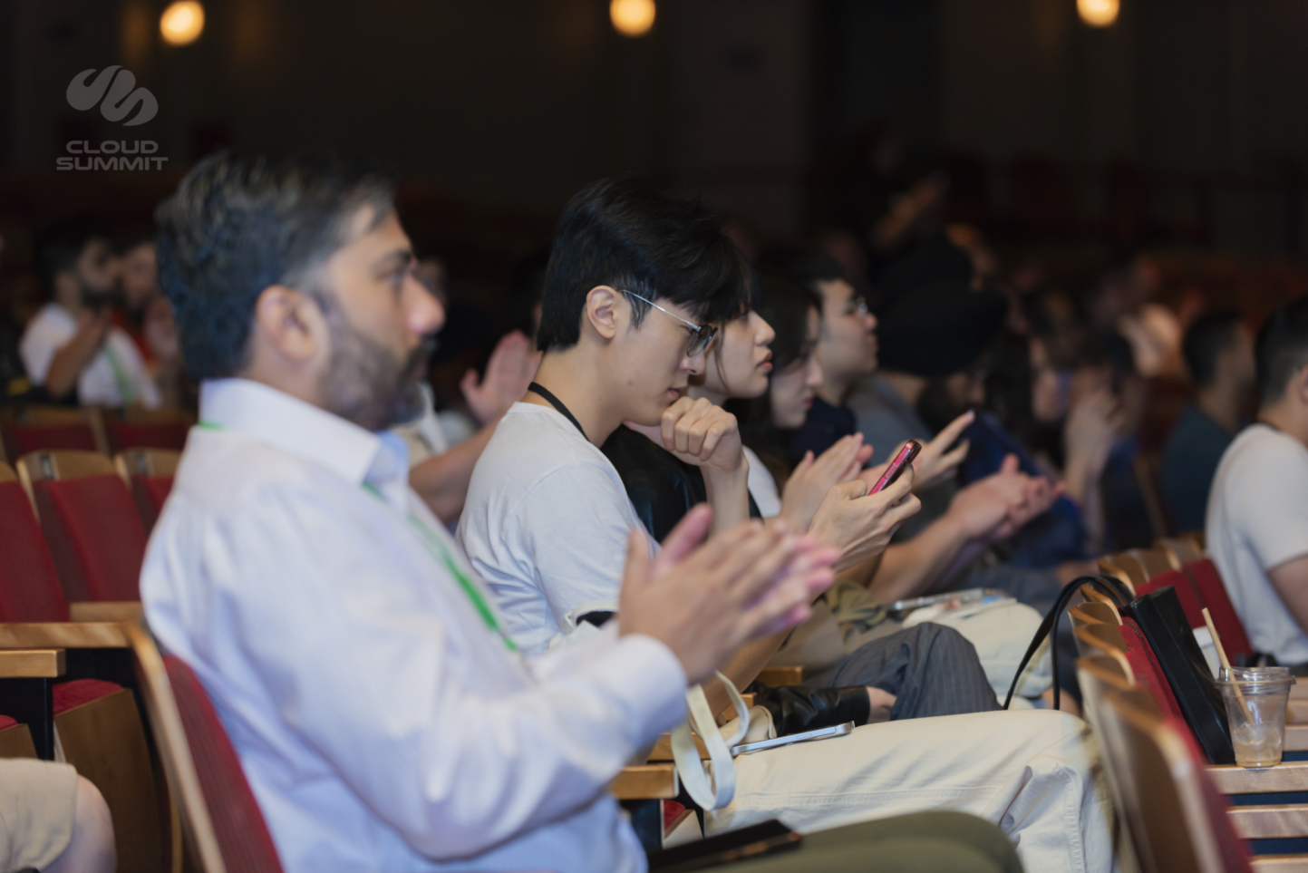 Audience listening to a Cloud Summit speaker session